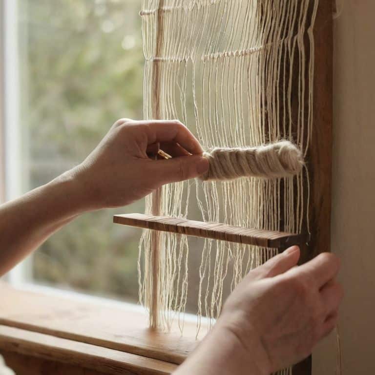 Adding fringe to woven wall hanging